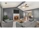 Inviting living room with fireplace, vaulted ceilings, ceiling fan, gray walls, and hardwood floors at 173 Michael Ln, Mcdonough, GA 30252
