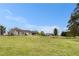 View of a well-maintained home nestled on a lush green lot, boasting scenic views and ample space at 173 Michael Ln, Mcdonough, GA 30252