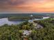 Stunning aerial view of the house and its wooded surroundings near the lake at 21 Edgewater Se Dr, Cartersville, GA 30121