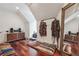 Attic with hardwood floors, lounge pillows, and decorative modern shelving and a full-length mirror at 21 Edgewater Se Dr, Cartersville, GA 30121