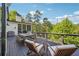 Back deck featuring outdoor dining and seating, with string lights and scenic views at 21 Edgewater Se Dr, Cartersville, GA 30121