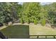 Professionally landscaped backyard featuring manicured lawn and ornamental trees at 21 Edgewater Se Dr, Cartersville, GA 30121