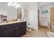 Functional bathroom featuring a single vanity, toilet, and shower with stone-look tiles at 21 Edgewater Se Dr, Cartersville, GA 30121