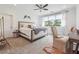 Bright bedroom featuring neutral decor, a ceiling fan, and seating area near windows at 21 Edgewater Se Dr, Cartersville, GA 30121