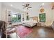 Bright bedroom with a large window, decorative decor, and wood floors at 21 Edgewater Se Dr, Cartersville, GA 30121