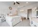 Bright bedroom featuring neutral decor, a ceiling fan, and access to a bathroom and closet at 21 Edgewater Se Dr, Cartersville, GA 30121