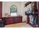Spacious walk-in closet featuring custom built-ins, an arched window, and plenty of hanging space at 21 Edgewater Se Dr, Cartersville, GA 30121
