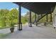 Expansive covered patio with staircase leading to yard and detailed support beams at 21 Edgewater Se Dr, Cartersville, GA 30121