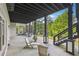 Spacious covered patio with ceiling and detailed support beams overlooking landscaped yard at 21 Edgewater Se Dr, Cartersville, GA 30121