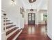 Gorgeous foyer with gleaming wood floors and modern lighting at 21 Edgewater Se Dr, Cartersville, GA 30121
