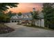 Beautiful exterior of this spacious home with a three car garage and inviting front porch at sunset at 21 Edgewater Se Dr, Cartersville, GA 30121