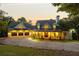Beautiful exterior of this spacious home with a three car garage and inviting front porch at dusk at 21 Edgewater Se Dr, Cartersville, GA 30121