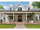 Inviting front porch with wood ceiling and beautiful stone pillars at 21 Edgewater Se Dr, Cartersville, GA 30121