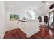 Upper hallway landing with rich wood floors and a view of the rooms on the floor at 21 Edgewater Se Dr, Cartersville, GA 30121