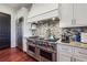 Modern kitchen with stainless steel range, countertops, and backsplash at 21 Edgewater Se Dr, Cartersville, GA 30121