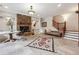 Inviting living room featuring a stone fireplace, staircase, and stylish decor at 21 Edgewater Se Dr, Cartersville, GA 30121