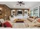 Spacious living room with stone accent wall, built-ins, and large windows for natural light at 21 Edgewater Se Dr, Cartersville, GA 30121