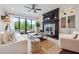 Bright, open living room with fireplace, access to patio, and comfortable seating at 21 Edgewater Se Dr, Cartersville, GA 30121