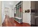 Hallway mudroom with a built-in storage bench and decorative wall accents and hardwood floors at 21 Edgewater Se Dr, Cartersville, GA 30121