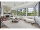 Cozy sunroom with lots of natural light, a fireplace, and comfortable seating perfect for relaxation at 21 Edgewater Se Dr, Cartersville, GA 30121
