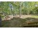 Expansive backyard features mature trees and a charming picket fence, perfect for outdoor enjoyment at 6221 Woodlore Nw Dr, Acworth, GA 30101