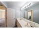 Clean bathroom with double vanity sinks and a well-lit mirror at 6221 Woodlore Nw Dr, Acworth, GA 30101