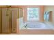 Bright bathroom with a separate shower, soaking tub, and natural light, a spa-like retreat at 6221 Woodlore Nw Dr, Acworth, GA 30101