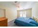 Cozy bedroom featuring a ceiling fan and window views at 6221 Woodlore Nw Dr, Acworth, GA 30101