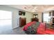 Spacious bedroom with dark wood furnishings and a wall-mounted television at 6221 Woodlore Nw Dr, Acworth, GA 30101