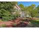 Inviting brick home featuring mature landscaping and attractive curb appeal at 6221 Woodlore Nw Dr, Acworth, GA 30101