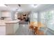 Open-concept kitchen with breakfast area and view into living room at 6221 Woodlore Nw Dr, Acworth, GA 30101
