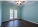 Bedroom featuring ceiling fan, crown molding, and French doors leading to the deck at 123 Wildwood Dr, Temple, GA 30179