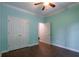Bedroom with tile flooring, ceiling fan, crown molding, and closet at 123 Wildwood Dr, Temple, GA 30179