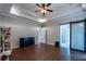 Open-concept living room featuring tile flooring, modern lighting, and glass sliding doors at 123 Wildwood Dr, Temple, GA 30179