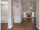 Bright and airy living room featuring a stone fireplace, hardwood floors, and neutral-toned walls at 123 Wildwood Dr, Temple, GA 30179