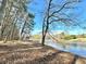 Lakeside view featuring waterfront access with a dock, providing opportunities for recreation and relaxation at 123 Wildwood Dr, Temple, GA 30179