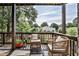 Charming back porch with wicker chairs and outdoor seating overlooking the backyard at 125 Sidney St, Marietta, GA 30060