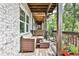 Relaxing outdoor space with lounge seating and a view of the serene backyard at 125 Sidney St, Marietta, GA 30060
