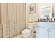 Bathroom featuring a toilet, cabinet and shower curtain at 125 Sidney St, Marietta, GA 30060