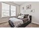 Cozy bedroom with natural light from two windows and charming wall décor at 125 Sidney St, Marietta, GA 30060
