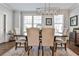 Bright dining room features hardwood floors, modern chandelier, and neutral decor, perfect for elegant entertaining at 125 Sidney St, Marietta, GA 30060
