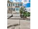 Charming brick townhome with a two-car garage, complemented by manicured landscaping and beautiful architectural details at 125 Sidney St, Marietta, GA 30060