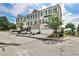 Well-maintained townhome with two car garage and brick exterior, complemented by lush greenery and a well-kept lawn at 125 Sidney St, Marietta, GA 30060