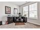 A well-lit office space with a large desk, office chair, and natural light at 125 Sidney St, Marietta, GA 30060