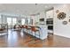 Open-concept kitchen with large island, modern appliances, and views to a sunlit dining area, creating a harmonious living space at 125 Sidney St, Marietta, GA 30060
