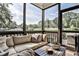 Comfortable screened porch with ample seating and serene views of the surrounding greenery at 125 Sidney St, Marietta, GA 30060