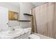 Bathroom with a vanity, toilet, shelves, and shower with curtain at 175 Springvalley Way, Stockbridge, GA 30281