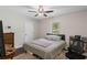Cozy bedroom with wood floors, a window, and a ceiling fan at 175 Springvalley Way, Stockbridge, GA 30281