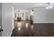 Inviting open-concept living area with hardwood floors, neutral walls, and natural light at 175 Springvalley Way, Stockbridge, GA 30281