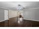 Open-concept living area featuring hardwood floors, neutral walls, and ample natural light at 175 Springvalley Way, Stockbridge, GA 30281